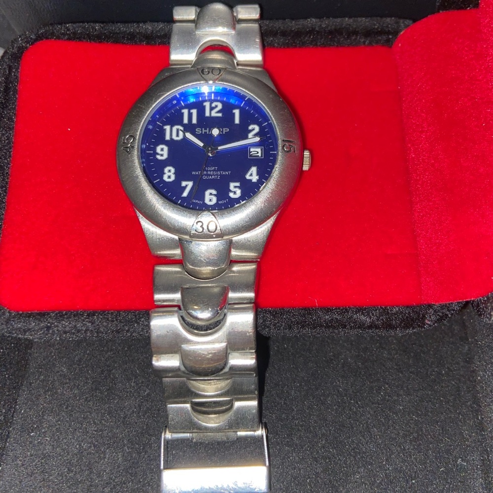 Sharp Blue Face Stainless Steel Bezel Watch.